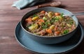 Plate with traditional fresh cooked lentil soup or stew isolated on wooden table Royalty Free Stock Photo