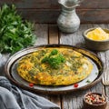 A plate of traditional Persian kuku sabizi herb omelet.