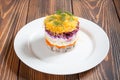 Plate of traditional russian salad called dressed herring Royalty Free Stock Photo