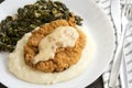 Chicken Fried Steak and Gravy with Mashed Potatoes and Collard Greens Royalty Free Stock Photo