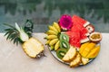 A plate of tropical fruits: watermelon, pineapple, bananas, mangosteen, passion fruit, mango and dragon fruit. Royalty Free Stock Photo