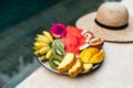 A plate of tropical fruits: watermelon, pineapple, bananas, mangosteen, passion fruit, mango and dragon fruit. Royalty Free Stock Photo