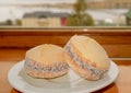 Alfajores, Traditional Latin American Filling Cookies on the Window Side Table