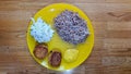 Plate with two cutlets, salad, boiled buckwheat and curry sauce Royalty Free Stock Photo