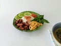 a plate of typical Jakarta uduk rice complete with side dishes