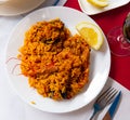 Typical spaish dish seafood paella with mussels, shrimps and rice