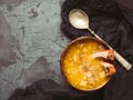 Plate of useful and dietary vegetable soup with a vintage spoon and croutons