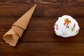 Plate of vanilla ice cream scoop swith sprinkles and waffle cones on wooden background with copy space Royalty Free Stock Photo