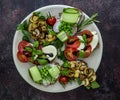 Plate with vegetarian sandwich toasts with different toppings, top view. Flat lay of rye bread crostini Royalty Free Stock Photo