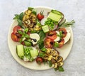 Plate with vegetarian sandwich toasts with different toppings, top view. Flatlay of rye bread crostini Royalty Free Stock Photo