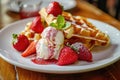 A plate of waffles and ice cream with strawberries Royalty Free Stock Photo