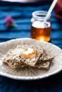 Plate with wasa bread and lilac jelly