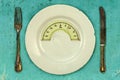 Plate with a weight balance scale. Diet concept