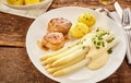 Plate of white asparagus and pork Royalty Free Stock Photo