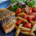 plate of wholemeal tomato pasta with trout, salad and wholemeal bread. Keto diet lunch