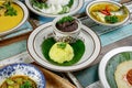 A plate of yellow glutinous rice pulut kuning with rendang