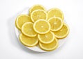 Plate with Yellow Lemon, citrus limonum, against White Background Royalty Free Stock Photo
