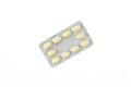 A plate of yellow pills on a white isolated background Royalty Free Stock Photo