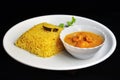 Plate of Yellow pulao and Prawn malai curry with coconut milk