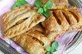 Plate with yummy berry puff pastry with apples and mint on table Royalty Free Stock Photo