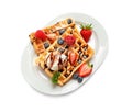 Plate with yummy waffles, berries and ice cream on white background Royalty Free Stock Photo