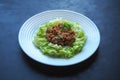 Plate of zucchini spaghetti with beef bolognese on black background. Royalty Free Stock Photo