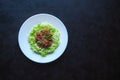 Plate of zucchini spaghetti with beef bolognese on black background. Royalty Free Stock Photo