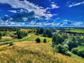 Plateau with a few trees under the foot of the mountain and was once a wilderness. Mountain landscape, valley, forest with green Royalty Free Stock Photo