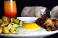 Sunny side up egg with mushrooms and zucchini