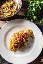 Plated Italian spaghetti carbonara with ham on top Royalty Free Stock Photo