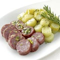 Plated Saucisson Vaudois with Farm-Fresh Vegetables Royalty Free Stock Photo