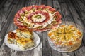 Plateful Of Appetizer Savory With Gibanica Crumpled Cheese Pie And Dish Of Olivier Salad Set On Old Cracked Wooden Garden Tab