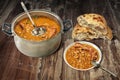 Plateful Of Delicious Baked Beans With Smoked Pork Ribs And Pitta Bread Served On Old Cracked Flaky Wooden Garden Table Royalty Free Stock Photo