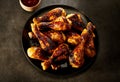 Plateful of delicious spicy grilled chicken legs