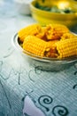 Plateful of fresh sweet organic corn steamed ready to eat. Prepared cooked sweet corn on the table