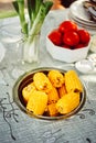 Plateful of fresh sweet organic corn steamed ready to eat. Prepared cooked sweet corn on the table