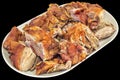 Plateful Of Freshly Spit Roasted Pork Shoulder Slices Served On Oblong Porcelain Platter Isolated On Black Background Royalty Free Stock Photo