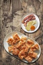 Plateful of Gibanica Crumpled Cheese Pie with Plate of Fried Egg and Bacon Rashers Set on Old Wood Background Royalty Free Stock Photo