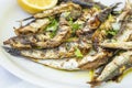 Plateful of Grilled Sardines Served with a Wedge of Lemon Royalty Free Stock Photo