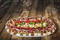 Plateful Of Traditional Serbian Appetizer Dish Meze Set On Old Weathered Cracked Flaky Garden Table Surface Royalty Free Stock Photo