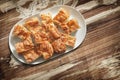 Plateful of Serbian Traditional Gibanica Crumpled Cheese Pie in Porcelain Oblong Platter Set On Old Garden Table