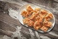 Plateful of Serbian Traditional Gibanica Crumpled Cheese Pie in Porcelain Oblong Platter Set On Old Garden Table