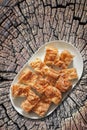 Plateful of Serbian Traditional Gibanica Crumpled Cheese Pie Set on Old Cracked Stump