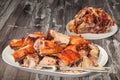Plateful Of Spit Roasted Pork Ham And Shoulder Slices Set On Old Cracked Garden Table