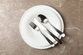 Plates cutlery on gray background, top view Royalty Free Stock Photo