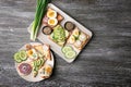 Plates with different delicious toasts on table Royalty Free Stock Photo