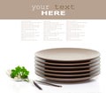 Plates, fork, spoon and parsley