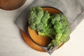 Plates with fresh broccoli on table, top view