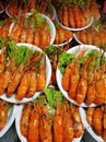 Plates of huge boiled shrimp at the street food market