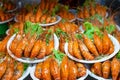 Plates of huge boiled shrimp at the street food market